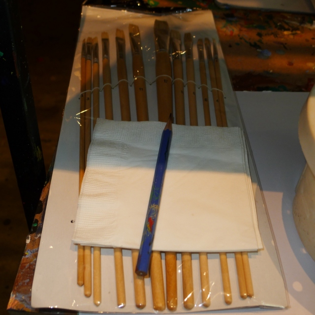 Pencil for sketching and napkins for drying wet brushes.  